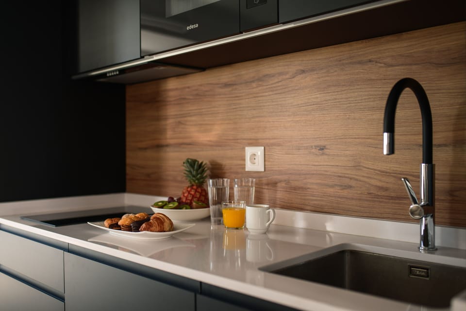 Mini-fridge, microwave, stovetop, cookware/dishes/utensils