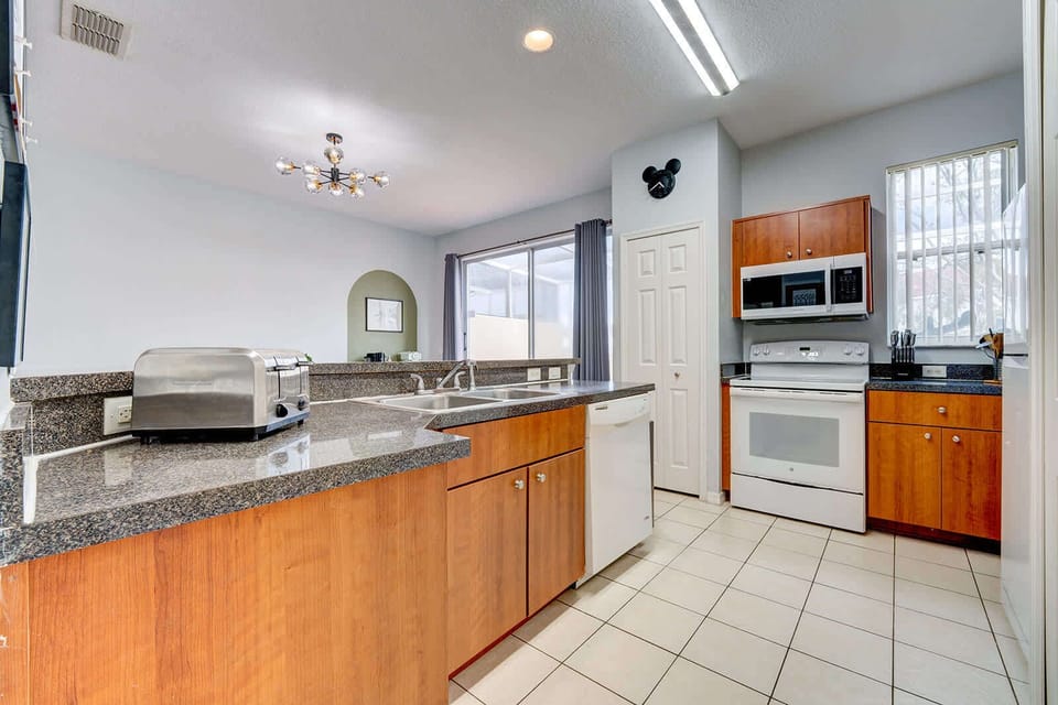 Modern kitchen with granite countertops and ample natural light