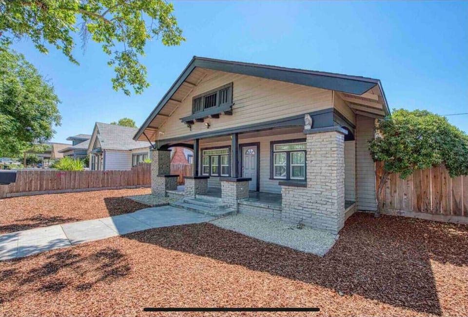 Charming house exterior with a well-kept front yard.