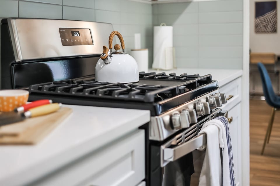 Kitchen - 5 burner stove with all the cooking amenities needed to cook delicious meals.
