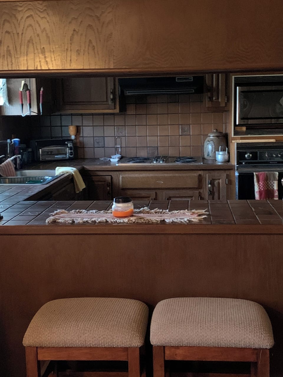 Full kitchen with tile countertops