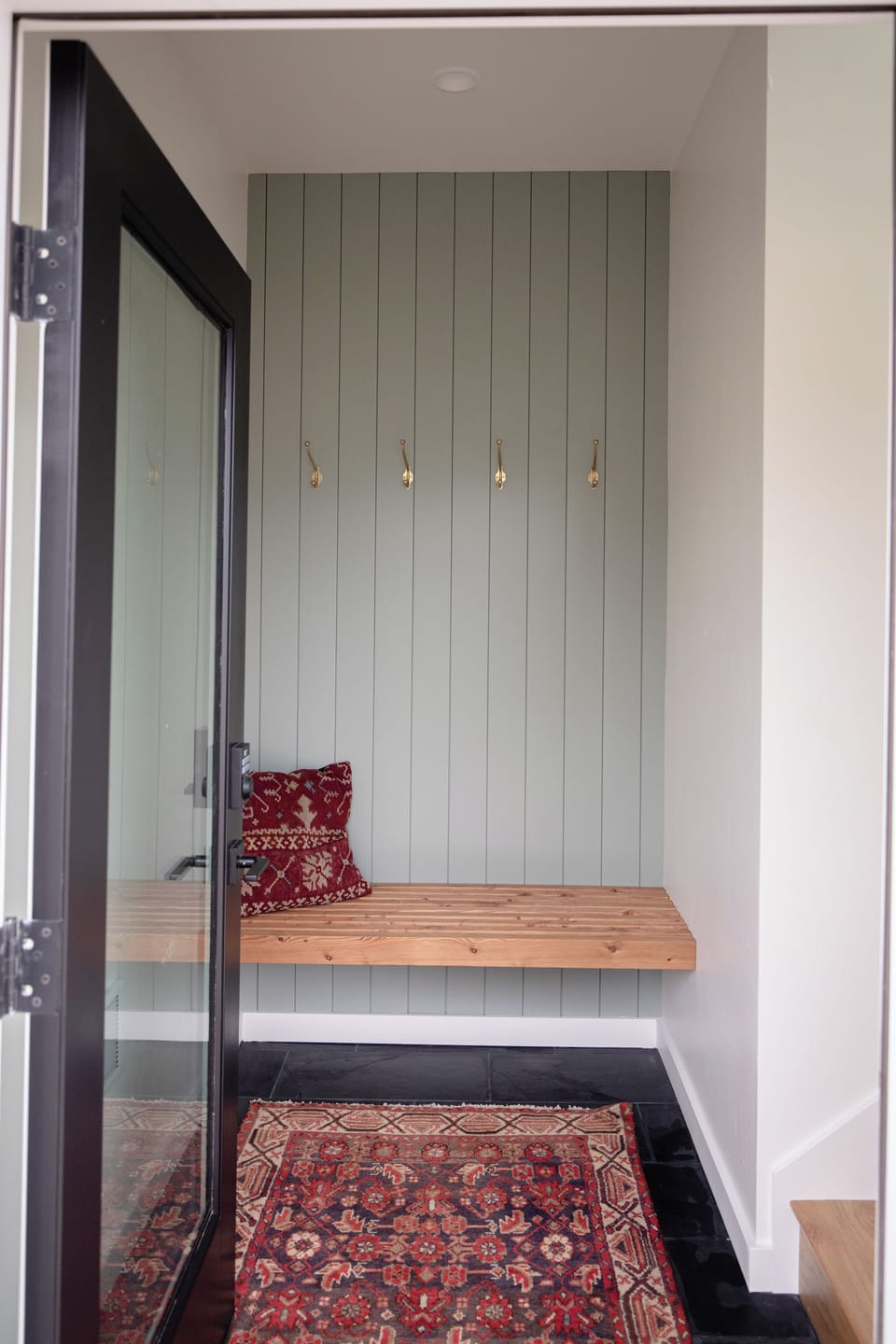 Entry with a bench and space for shoes and coats