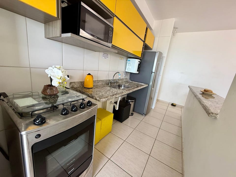 Panoramic Apartment | Private kitchen | Fridge, cookware/dishes/utensils