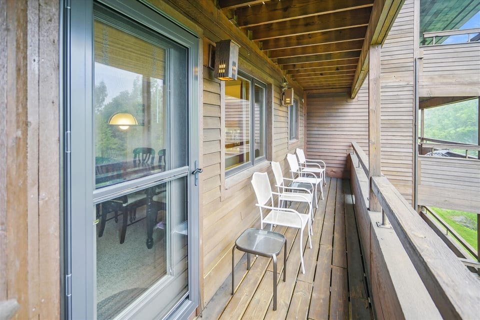 Step out onto the private balcony and enjoy fresh mountain air with seating for morning coffee or evening unwinding.