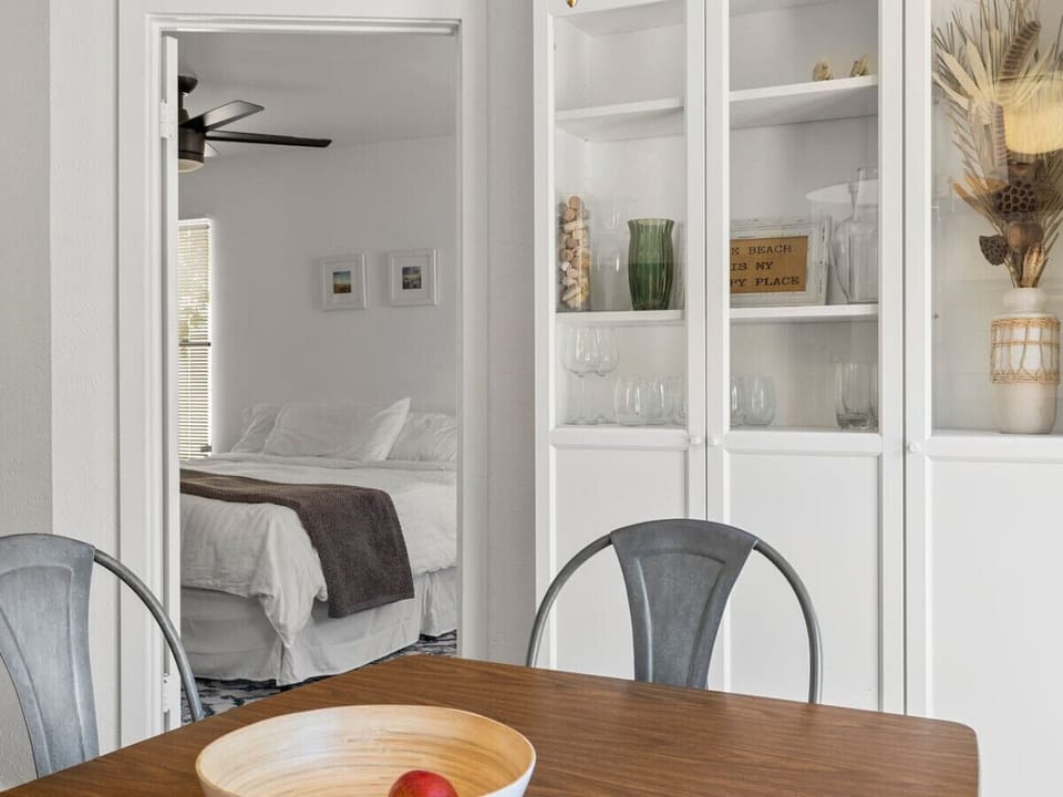Enjoy a meal with a view of the cozy bedroom—open-concept and inviting!