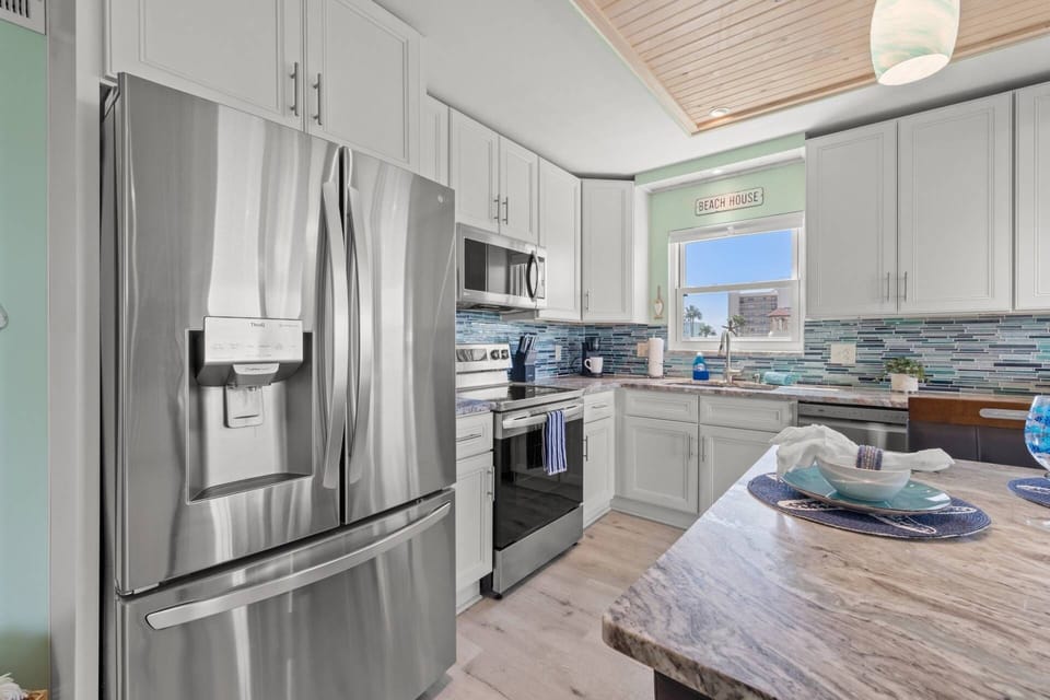 Kitchen Features Stainless Steel Appliances and Granite Countertops