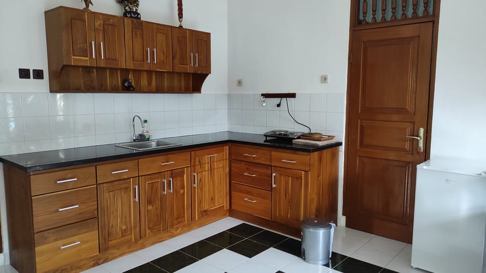 Family Bungalow | Private kitchen | Fridge, electric kettle