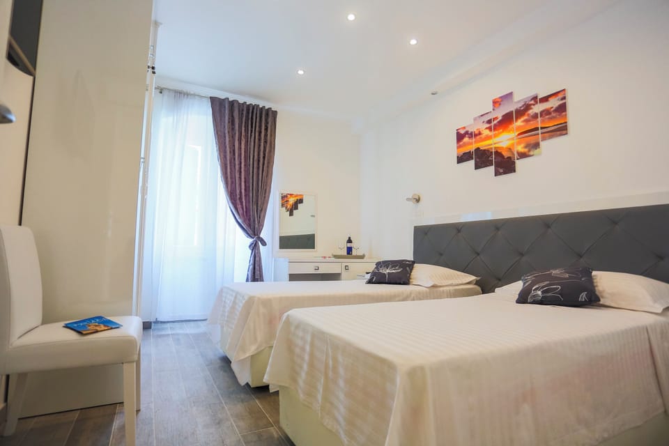 Deluxe Twin Room, 2 Twin Beds | In-room safe, desk, laptop workspace, blackout drapes