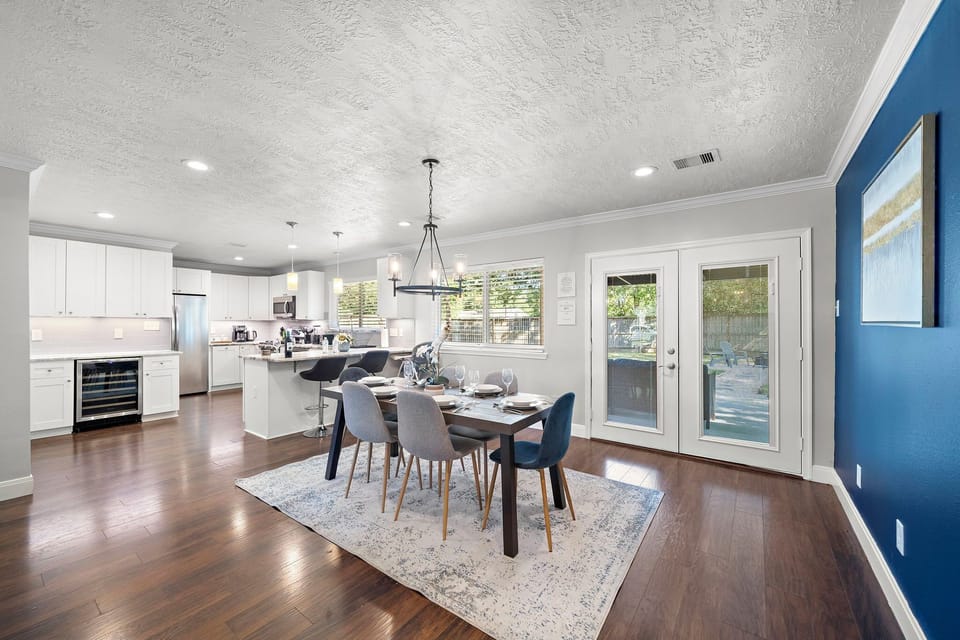 Spacious dining table that sits 6 with full tableware and silverware included.