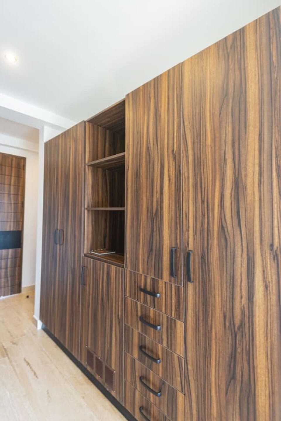 Stylish wooden wardrobe: functional storage with luxe finishes.