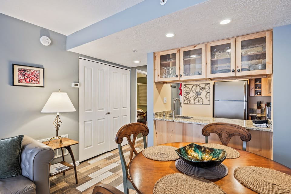 Inviting dining area with seating for meals and a convenient kitchen bar for additional space and entertaining.