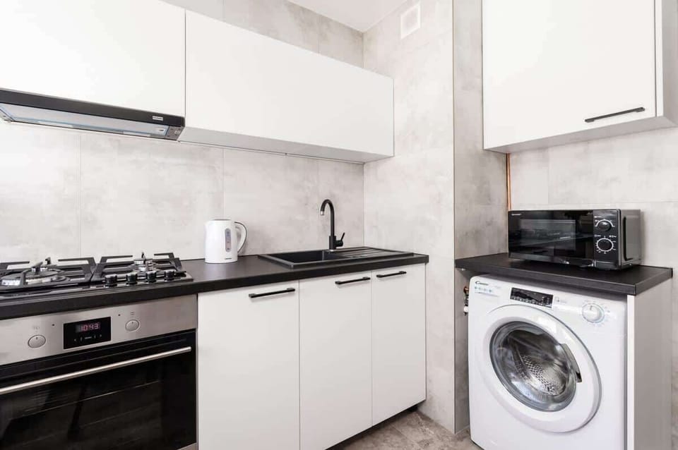 A fully equipped kitchen with a gas stove, oven, and plenty of space for cooking.

