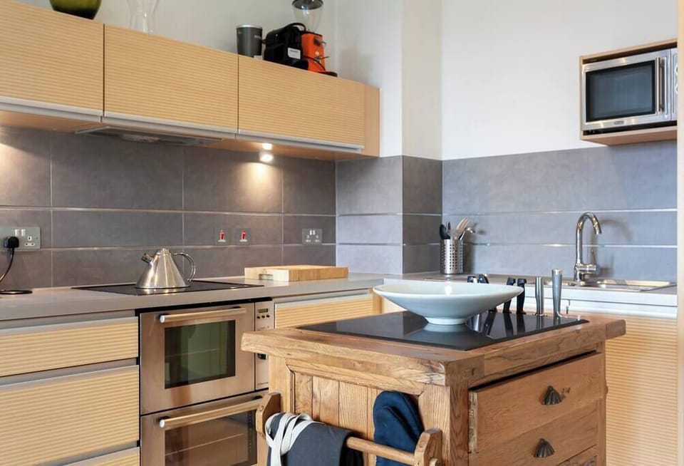 Enjoy dinner with views over Manchester from your open plan kitchen and dining space