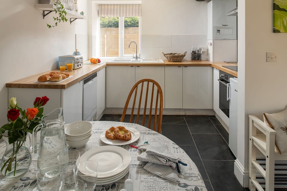The dining table in the kitchen at The Milking Parlour, Wiltshire