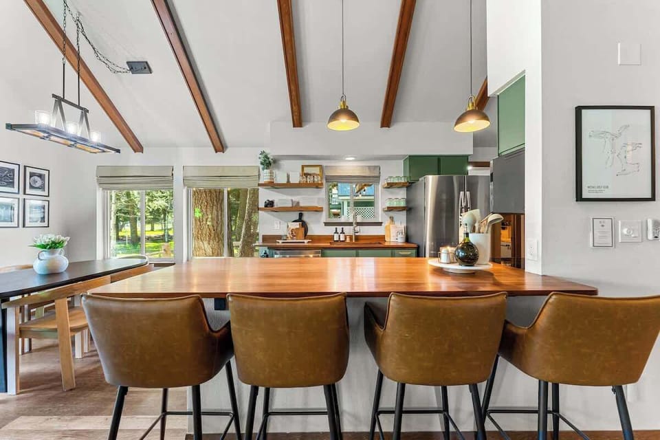 A newly designed and updated open concept kitchen is perfect for the whole group to hang out during meal times and to catch up on old times.