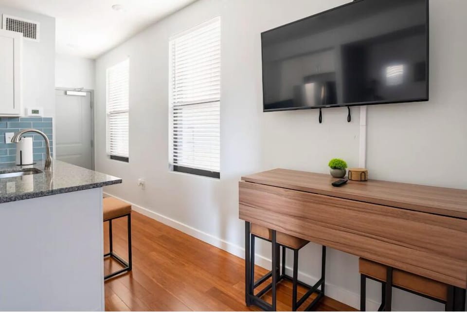 Entryway, room darkening shades, dining seating that expands to seat 4 people.