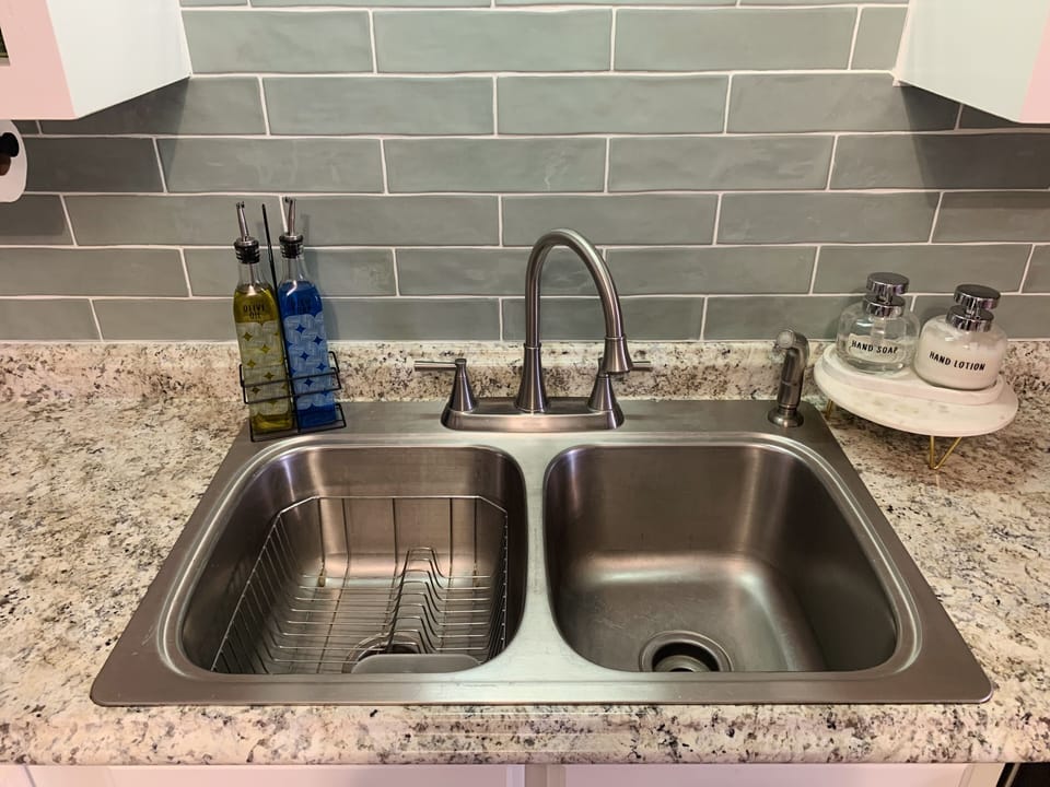 Stainless steel sink and dish rack with everything labeled!