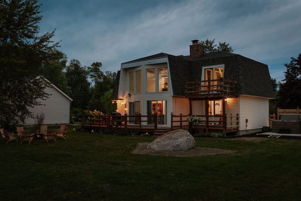 Our lakeside lodge glows warmly at night, inviting you to relax and enjoy the serene surroundings.