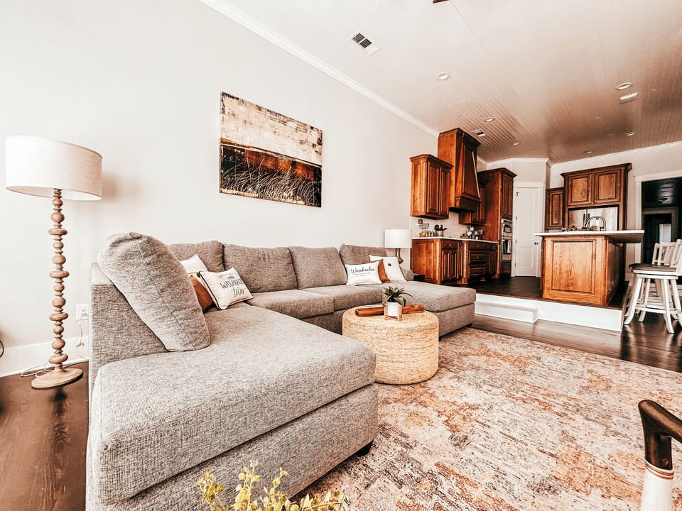 Open concept living room and kitchen. The couch can sleep two people comfortably. 