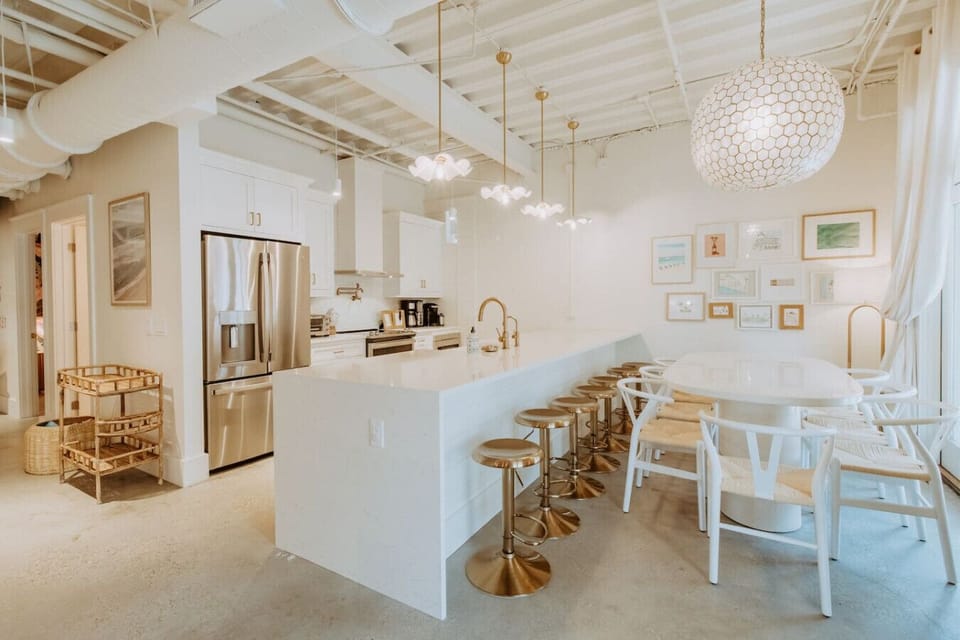 Open-concept bliss! Whip up breakfast in the dreamy kitchen, then gather around the oversized dining table for memories made over meals.