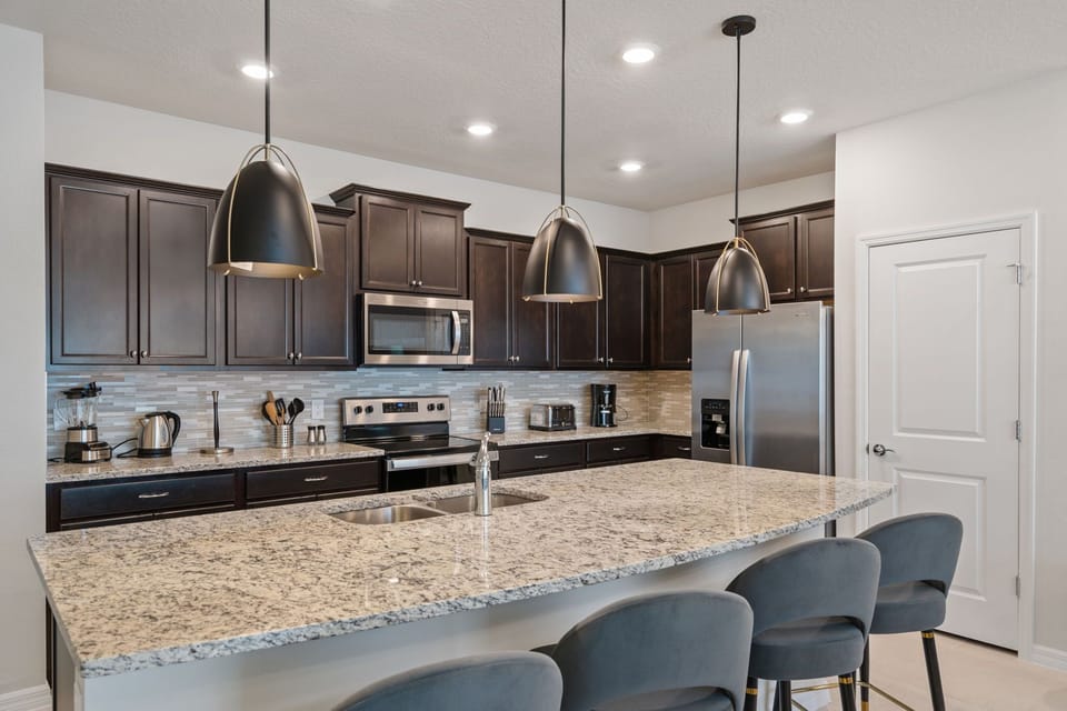 Family Feasting Hub: Kitchen with Stainless Steel and Kid-Friendly Counter
