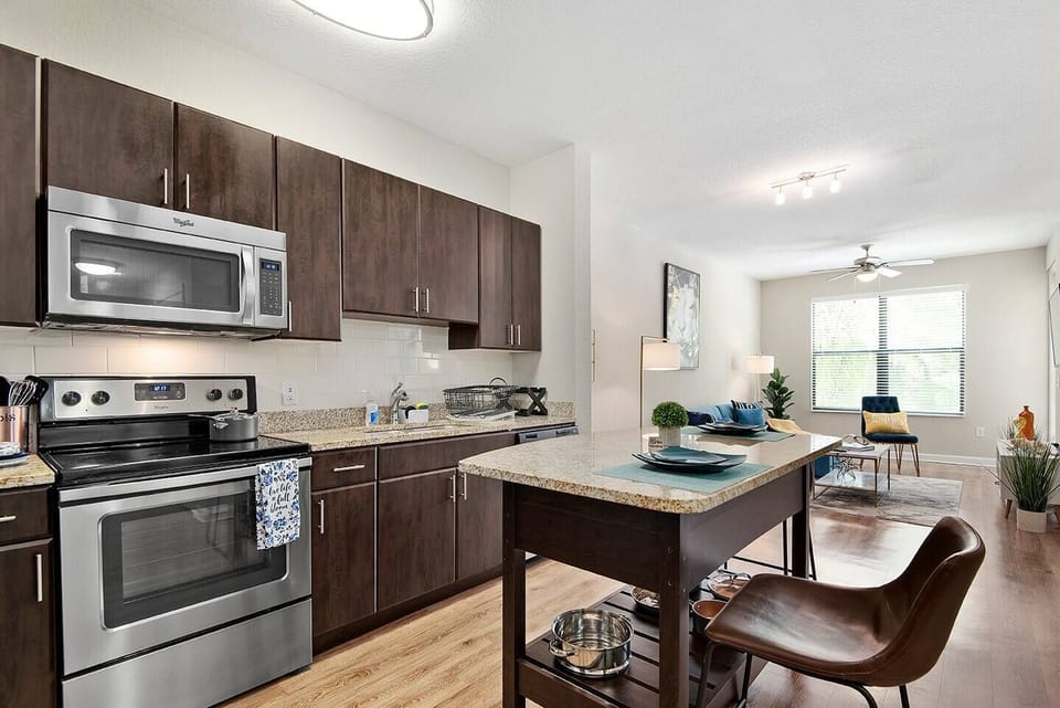 Spacious and well equipped kitchen with eat-in bar.