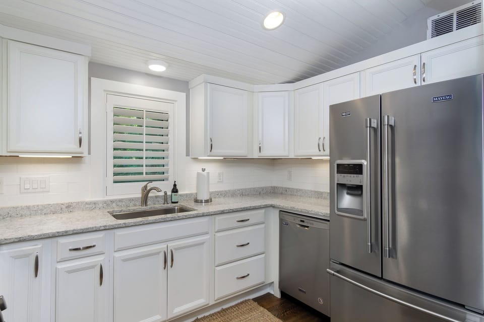 Main level kitchen with a dishwasher & duo coffeemaker (drip-style + Keurig).