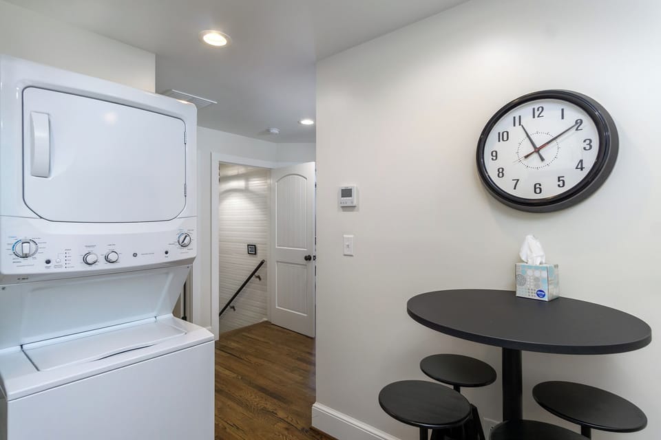 Staircase leading to upper-level bedrooms and kitchen. Note: When using the interior stairway, please exercise caution, always use the handrail, and be aware of steep and shallow steps.