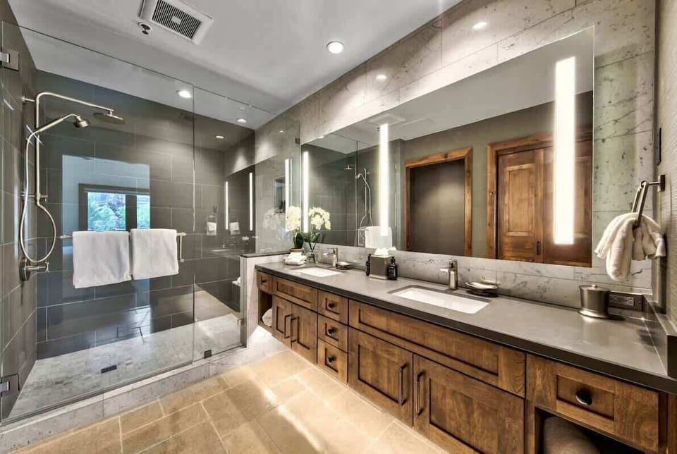 Clean, modern primary bathroom with generous vanity space and a relaxing, spa-inspired feel.