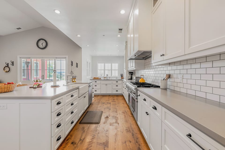A full suite of modern appliances, including a large gas range.