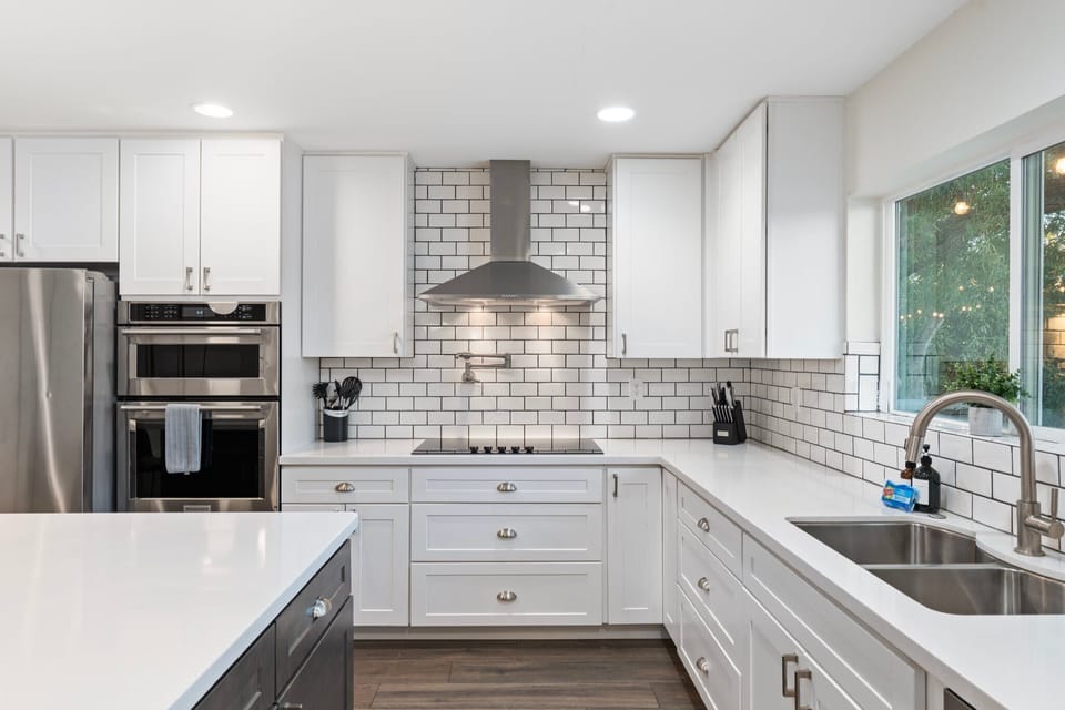 Updated, modern, fully stocked kitchen with stainless steel appliances