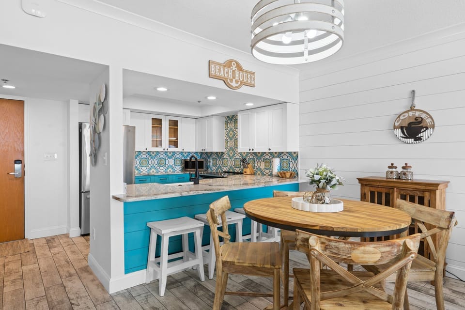 Enjoy meals at the table for 4 or grab a seat at the bar—all in the open-concept space.

Professionally Managed by
Breathe Easy Rentals
