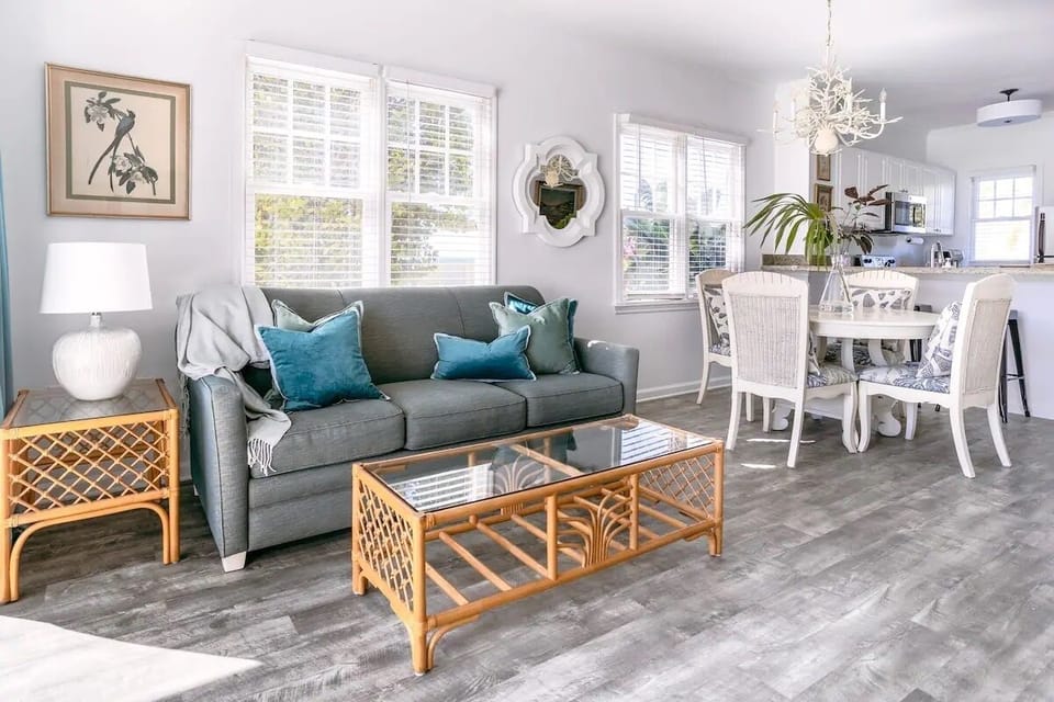 The first floor is open-plan w/ a kitchen leading into the dining & living areas