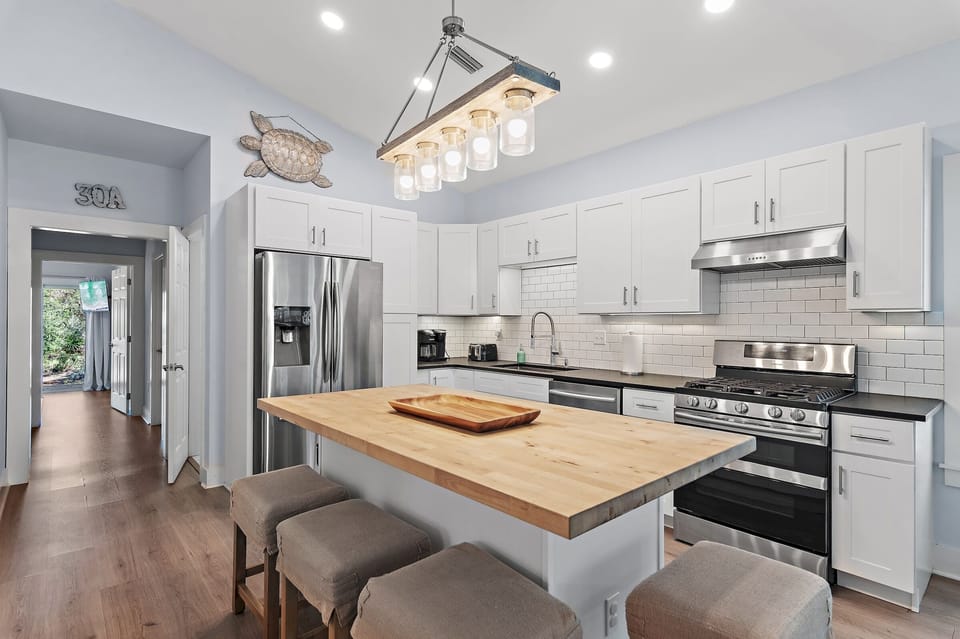 Cook and entertain in style with our fully furnished kitchen featuring ceramic pots and pans, coffee maker, toaster, and complimentary essentials like salt, pepper, and more. The spacious island is perfect for meal prep and family gatherings.