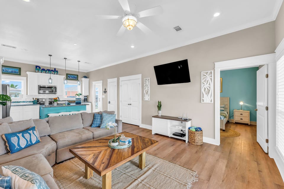 Relax in the living room on the comfortable couch while enjoying your favorite shows (3)