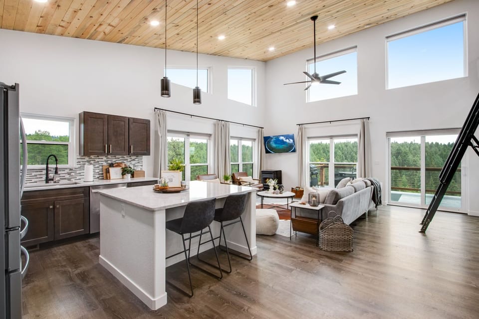 Floor-to-ceiling windows w/ electric shades. Light floods this space.
