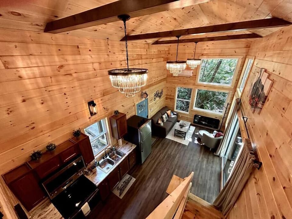 Up in the loft looking down to the kitchen and living area. 