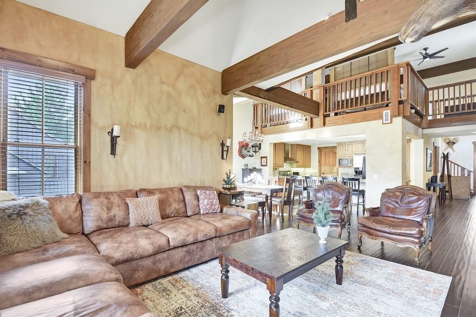 Living room open to the kitchen and dining areas