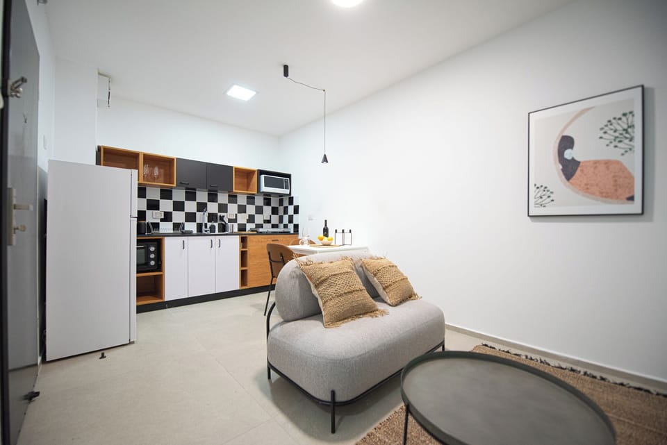 Classic Apartment, 2 Bedrooms, Balcony | Living area | 42-inch flat-screen TV with digital channels, Netflix
