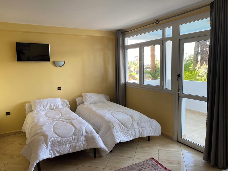 Economy Quadruple Room, City View | Free WiFi, bed sheets