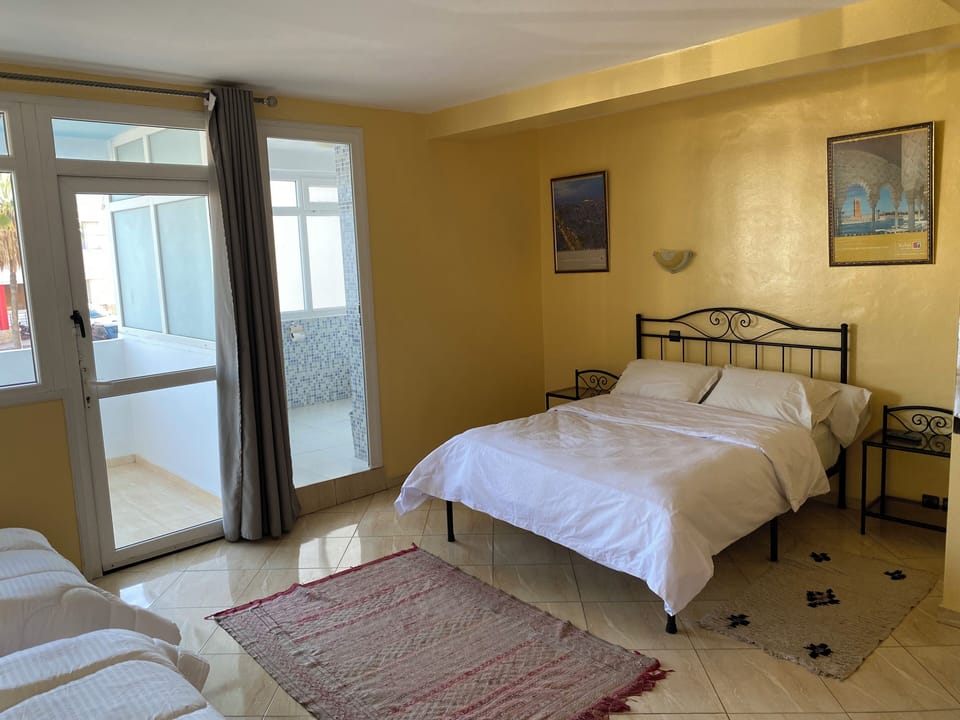 Economy Quadruple Room, City View | Free WiFi, bed sheets