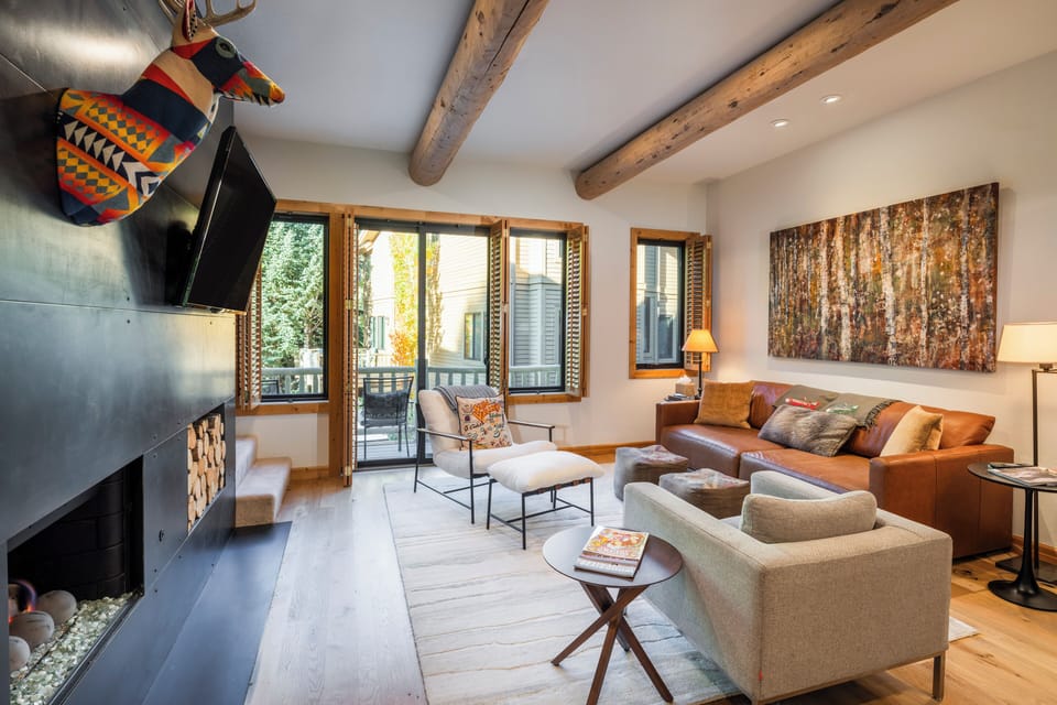 Luxurious living room features unobstructed views of Bald Mountain