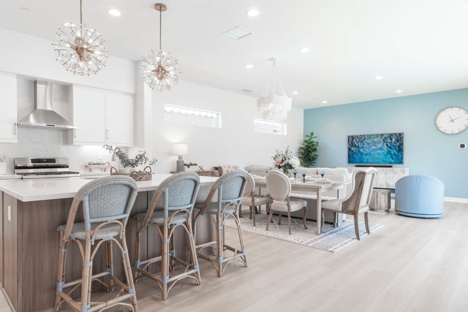 Open kitchen & dining area with skylights flooding the space with natural light.