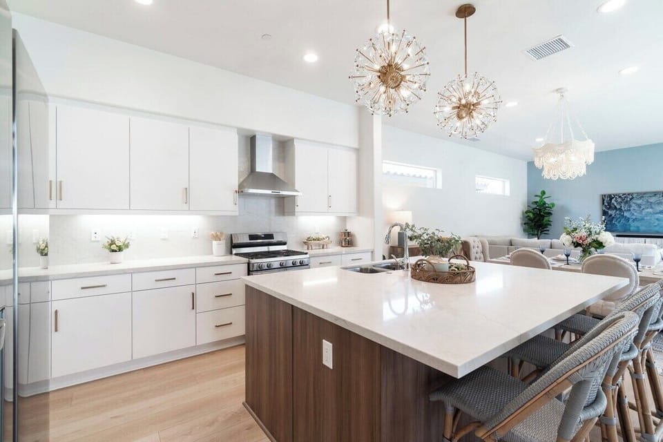 White quartz island with wood cabinetry.