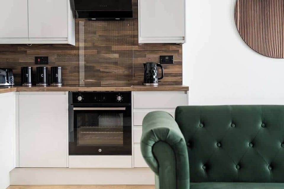 Full Kitchen | Fully equipped kitchen with everything you need for a short or long stay, including a fresh water dispenser, coffee machine, washing machine and dryer, and a dishwasher.