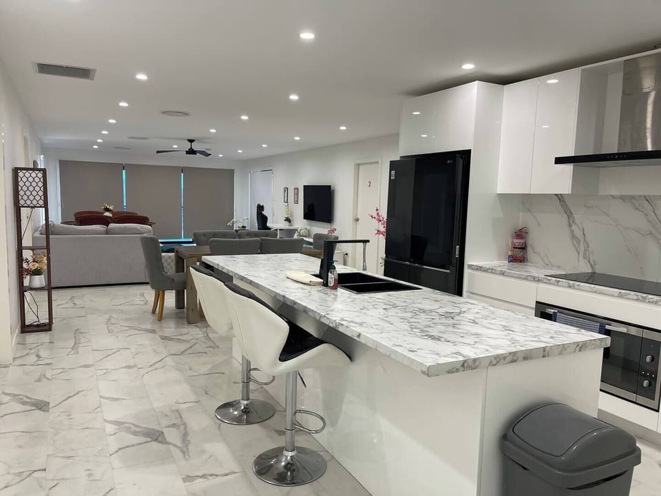huge modern full kitchen and living area.