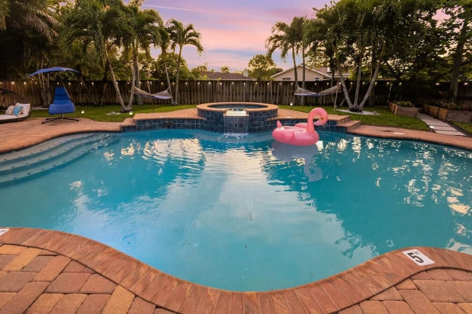 Listen to the coastal breeze in the palms as you lounge poolside at sunset.