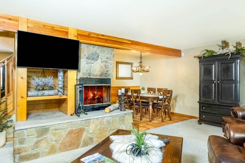 The fireplace can be enjoyed from the living room or dining around with its corner placement