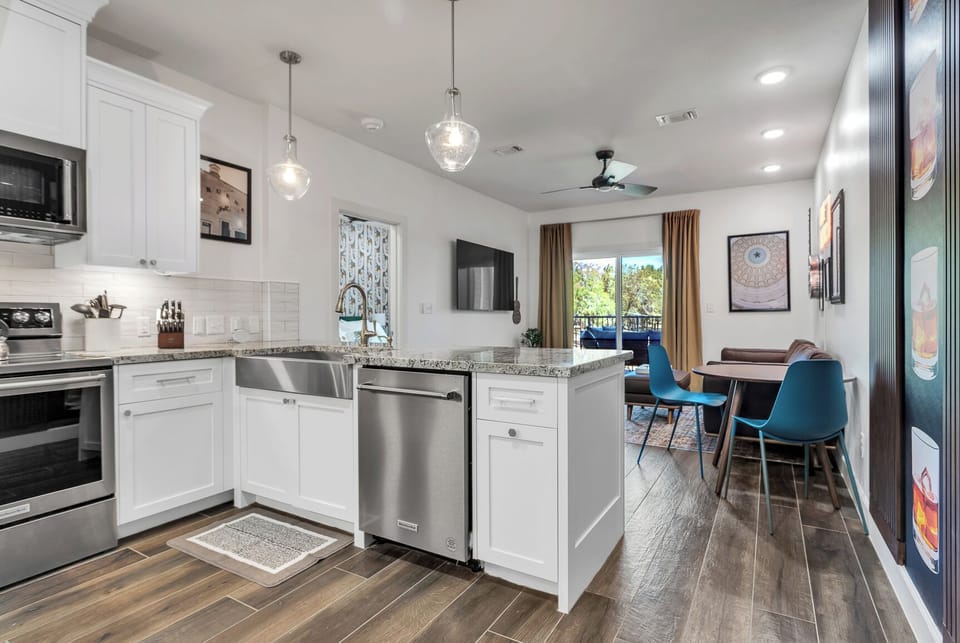 Spacious kitchen and living with desk and dining area