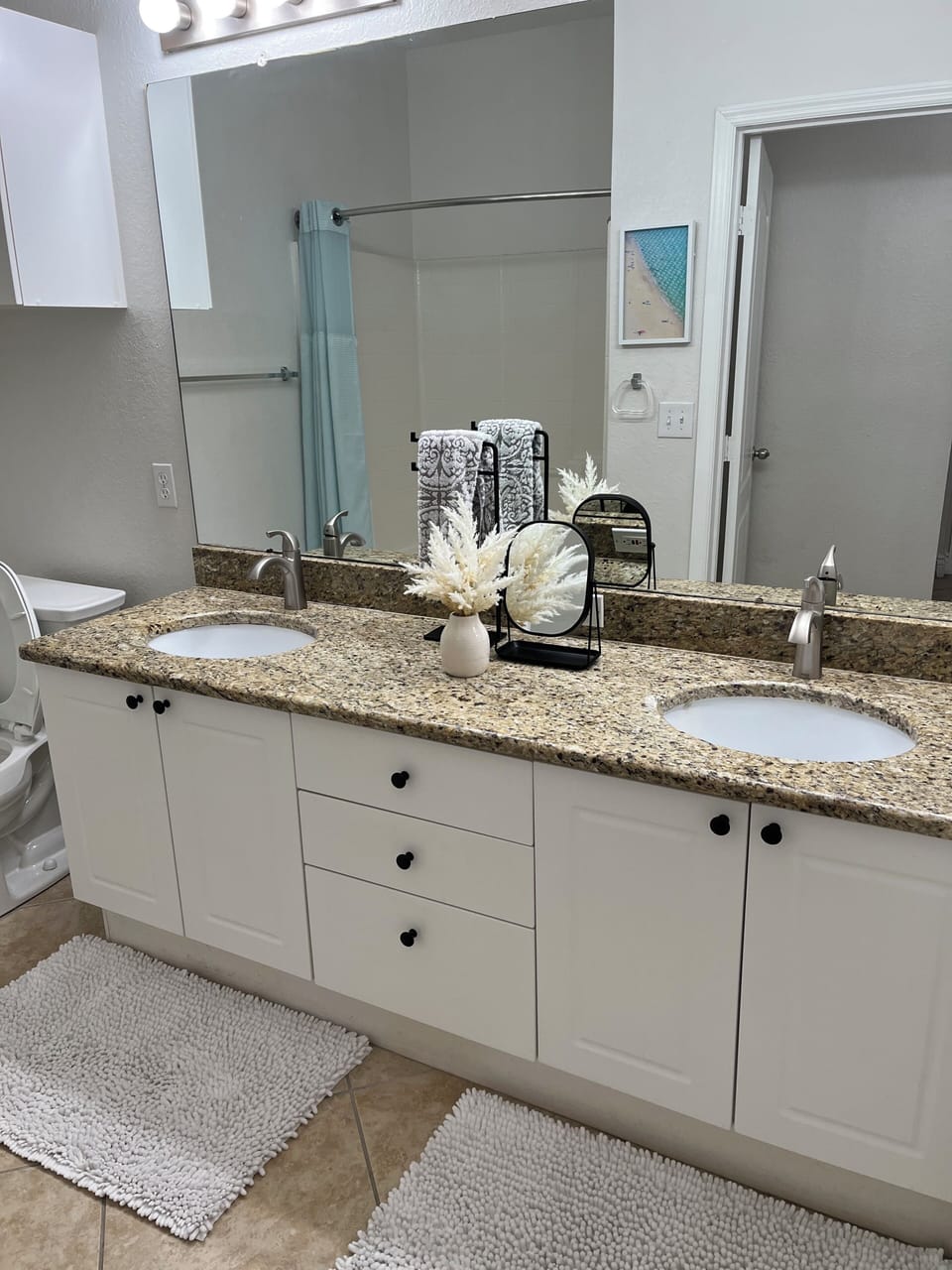 Double vanity with tub shower combo
With removable shower head 